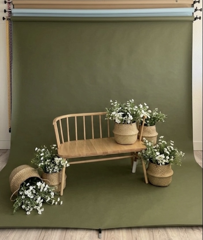 Olive green photography studio set with bench and flowers