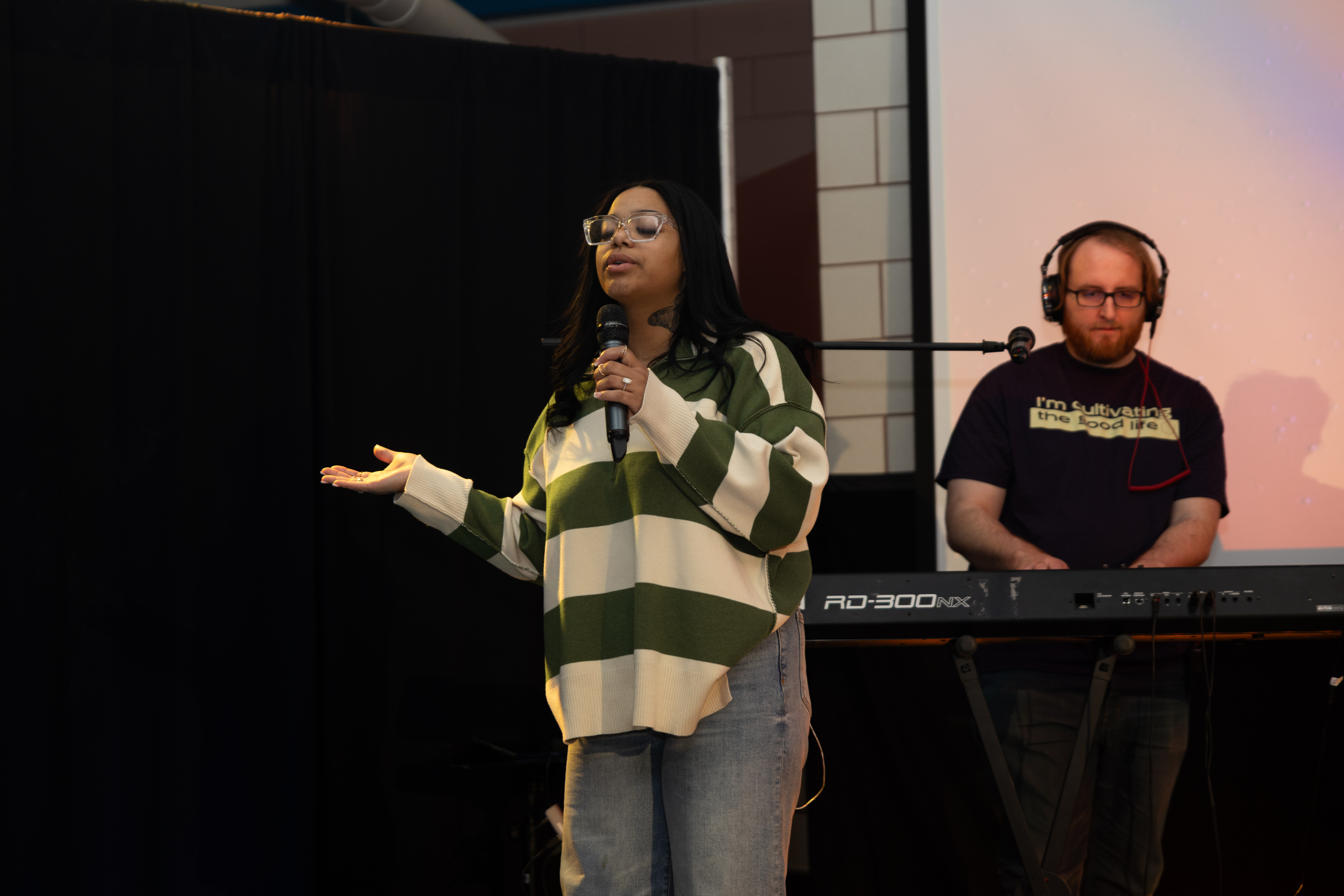 Worship leader speaking during a faith gathering